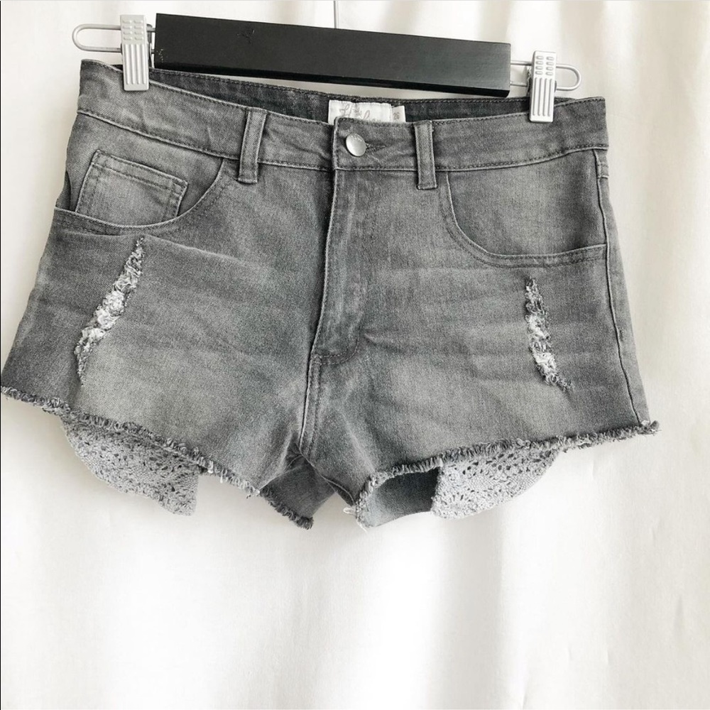 Harlow mid rise black distressed denim shorts
